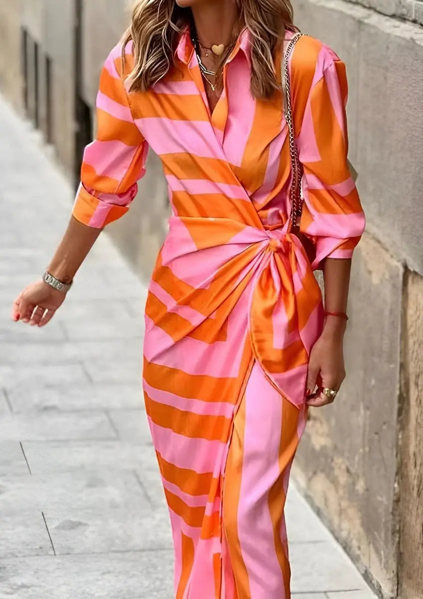 Fashionable women's long sleeve midi dress with a flattering striped wrap design. Perfect for summer events.