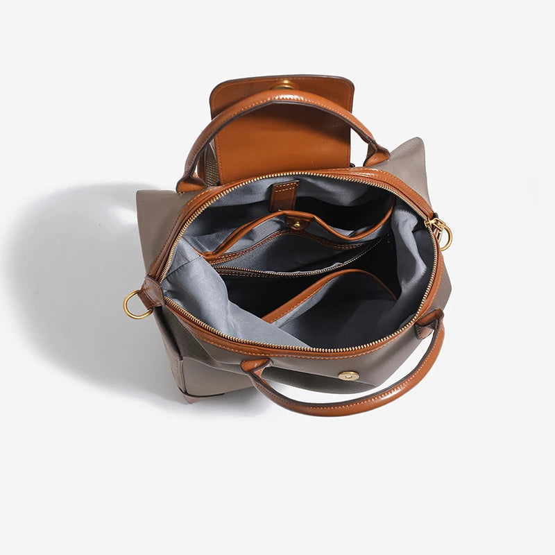 Stylish structured women's backpack, leather trim accents a versatile and spacious everyday travel bag.