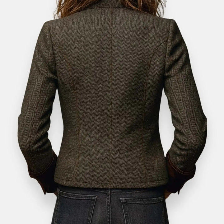 Women's quilted utility jacket, structured and sophisticated, enhanced with shimmering gold button accents.