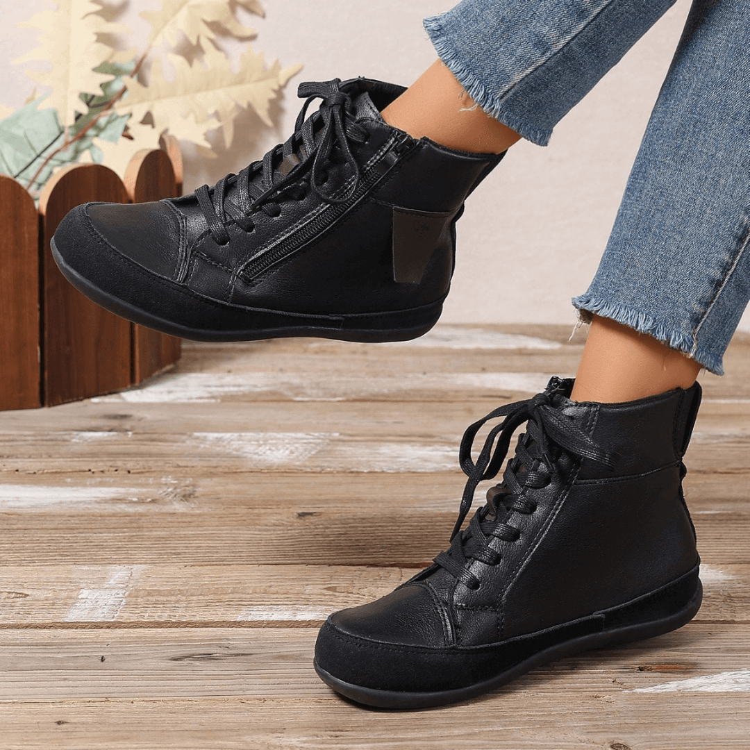 Elegant women's ankle boots with side zipper. Fashionable round toe design for versatile casual winter wear.