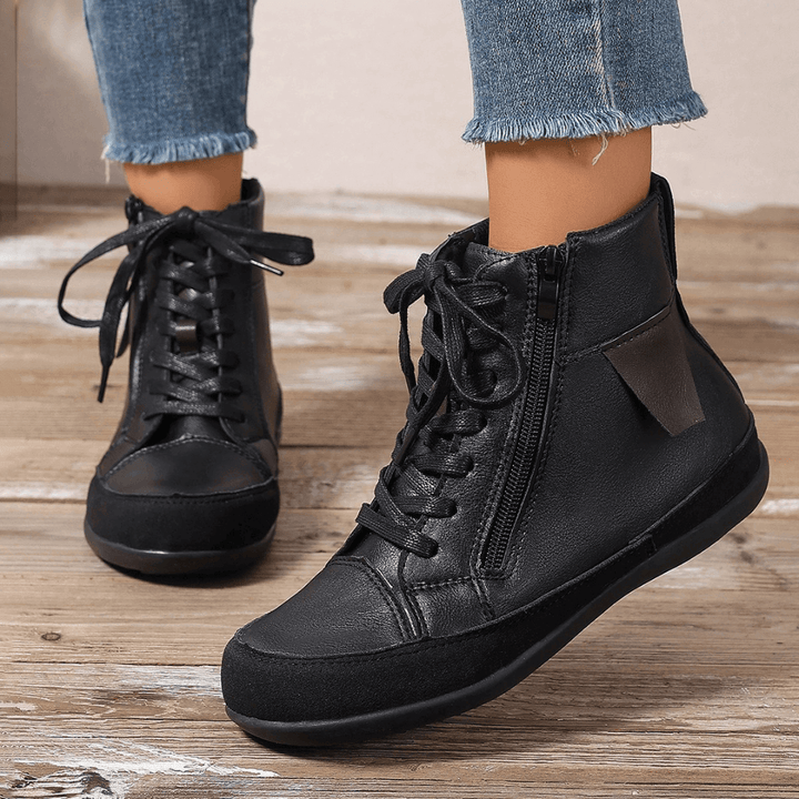 Womens fall ankle boots with easy side zipper, comfortable round toe. Chic and practical winter footwear.
