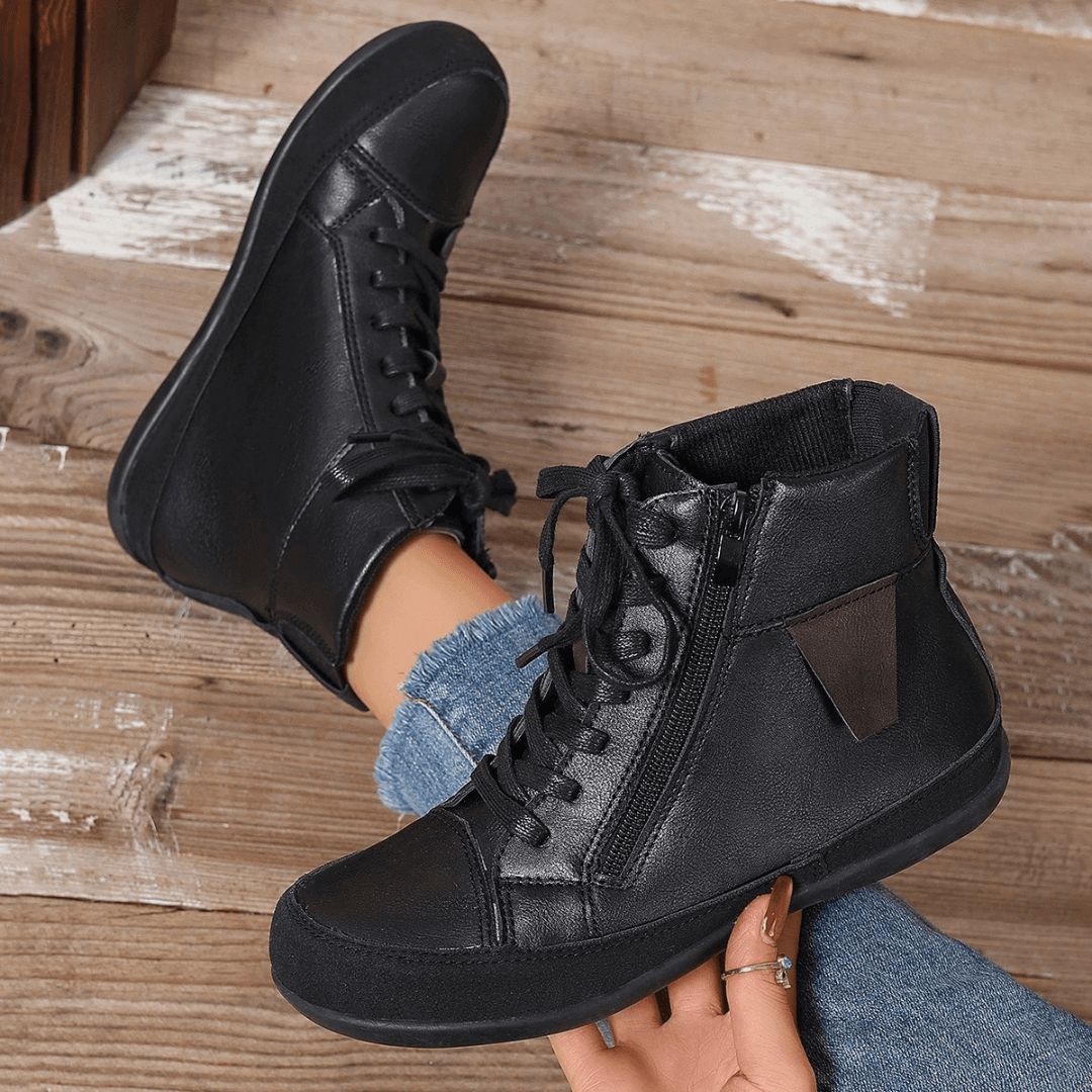 Fashionable women's ankle boots with side zipper closure & classic round toe. Ideal for casual fall outfits.