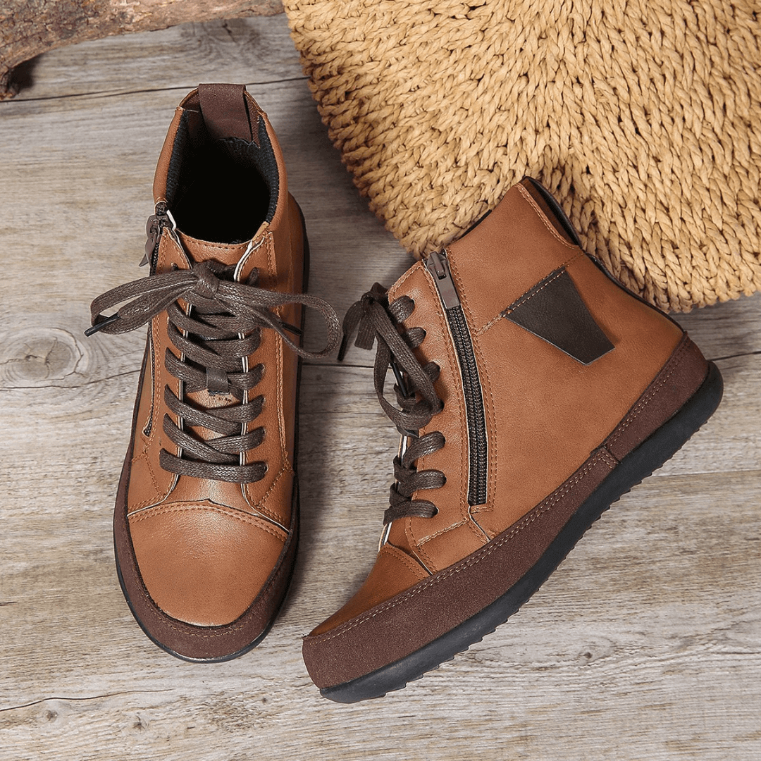 Stylish women's round toe ankle boots. Features convenient side zipper. Essential elegant fall/winter footwear.