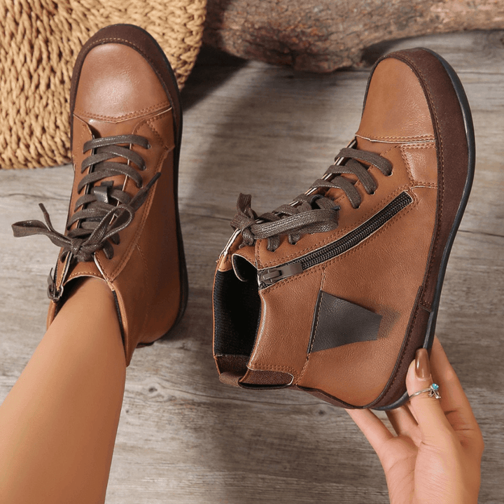Comfortable women's ankle boots with a practical side zipper. Round toe design, great for fall & winter fashion.