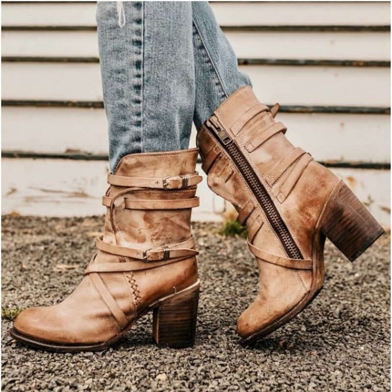 Women's stylish ankle boots with multiple buckle straps, side zipper, and sturdy block heel. Versatile fashion footwear.