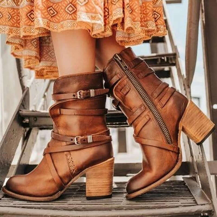 Stylish women's ankle boots with eye-catching buckle details and a comfortable block heel. Versatile fashion shoes.