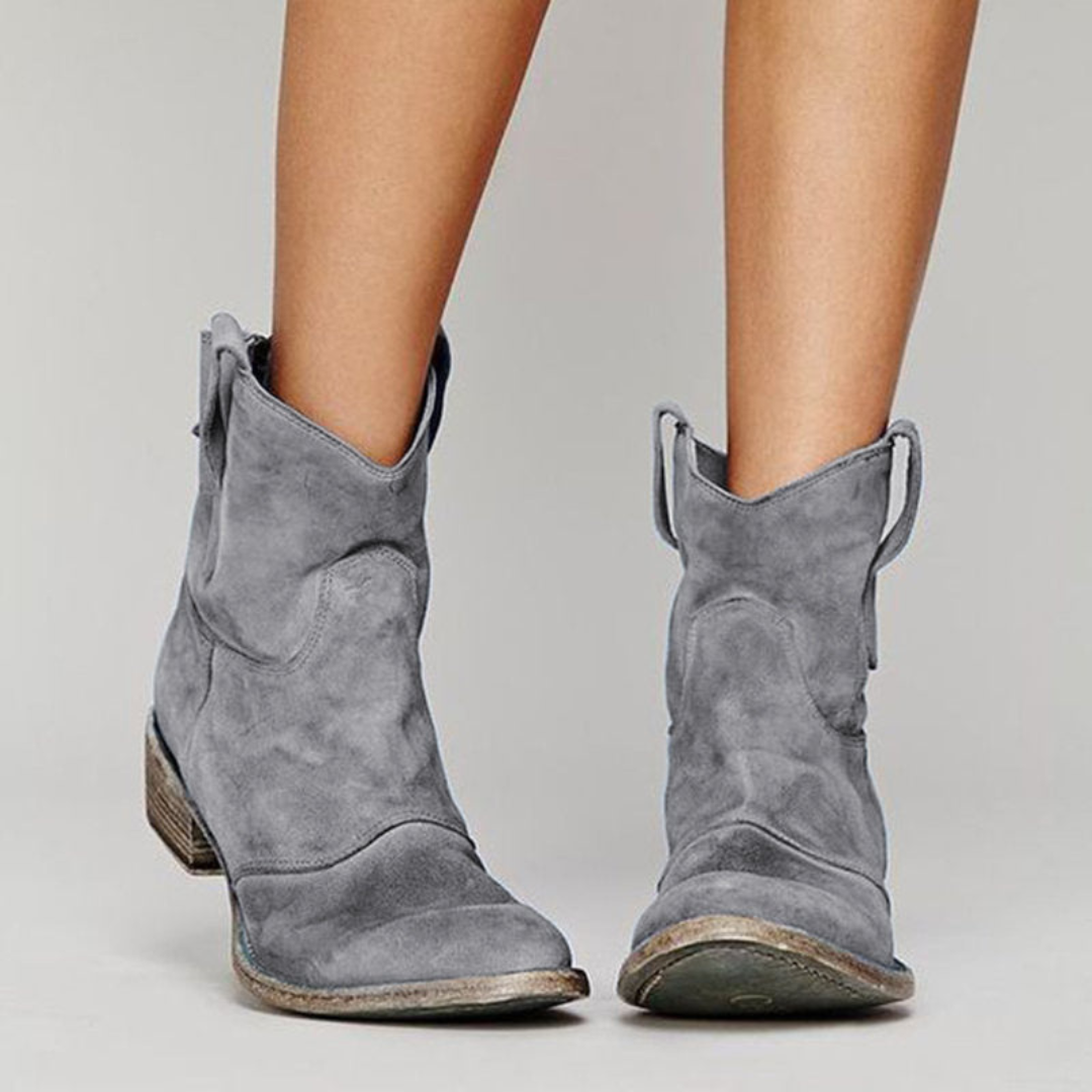 Fashion-forward women's ankle western boots with pull tabs. Comfortable low heel, ideal for daily casual style.