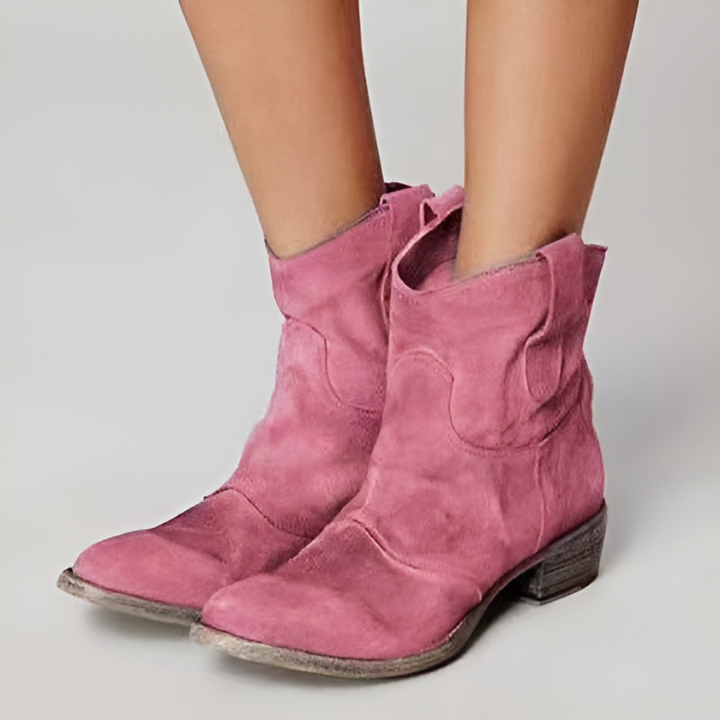 Women's ankle western boots with pull tabs. Stylish, comfortable low heel footwear for versatile everyday fashion.