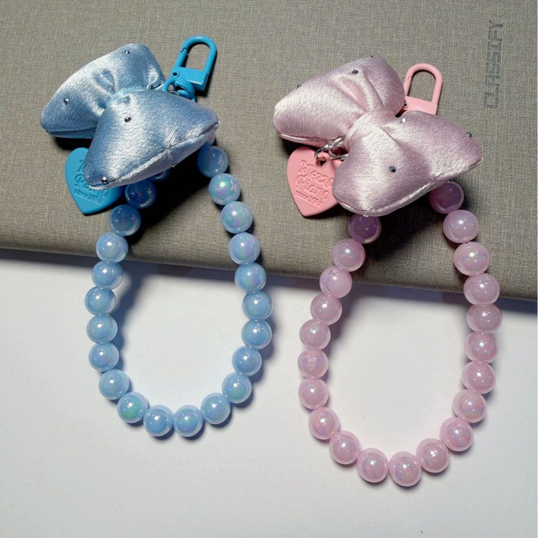 Colorful beaded keychain for women, featuring a sleek bow, ideal for personalizing bags or keys.