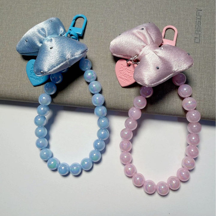 Colorful beaded keychain for women, featuring a sleek bow, ideal for personalizing bags or keys.
