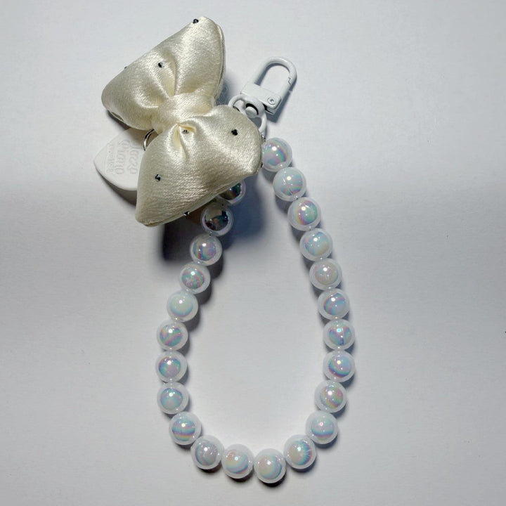 Vibrant beaded women's keychain with a playful bow, a fun and functional key or bag charm.