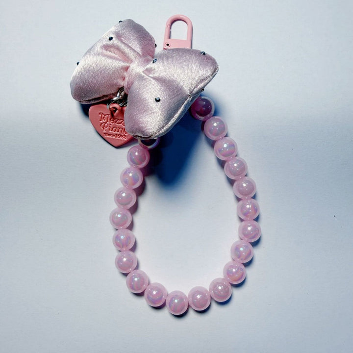 Elegant women's beaded keychain featuring a prominent bow, great for keys, bags, or as a gift.