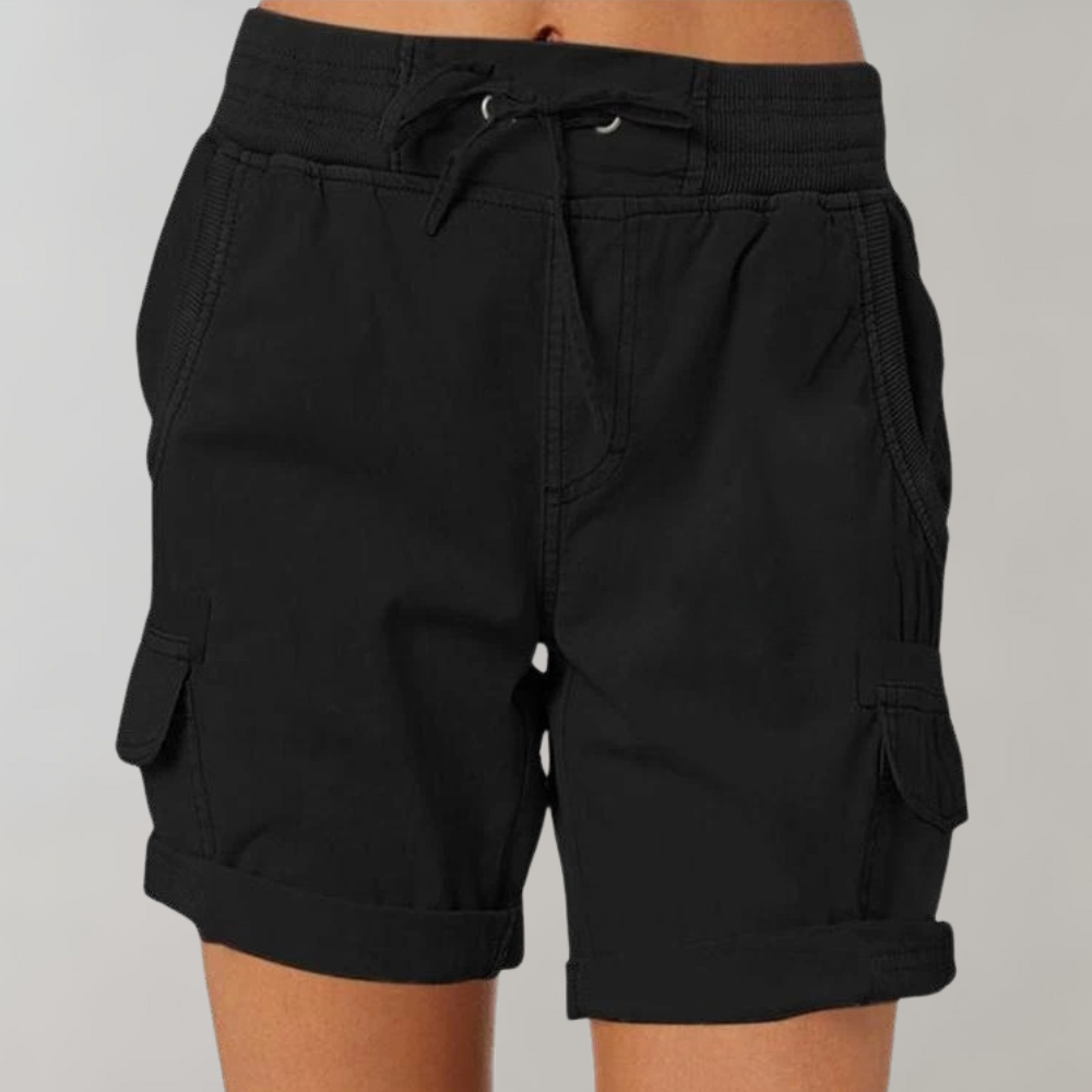 Woman wearing stylish relaxed-fit cargo shorts, ideal for casual summer fashion, outdoor adventures, or comfortable daily wear.