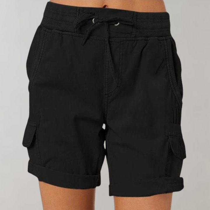 Woman wearing stylish relaxed-fit cargo shorts, ideal for casual summer fashion, outdoor adventures, or comfortable daily wear.
