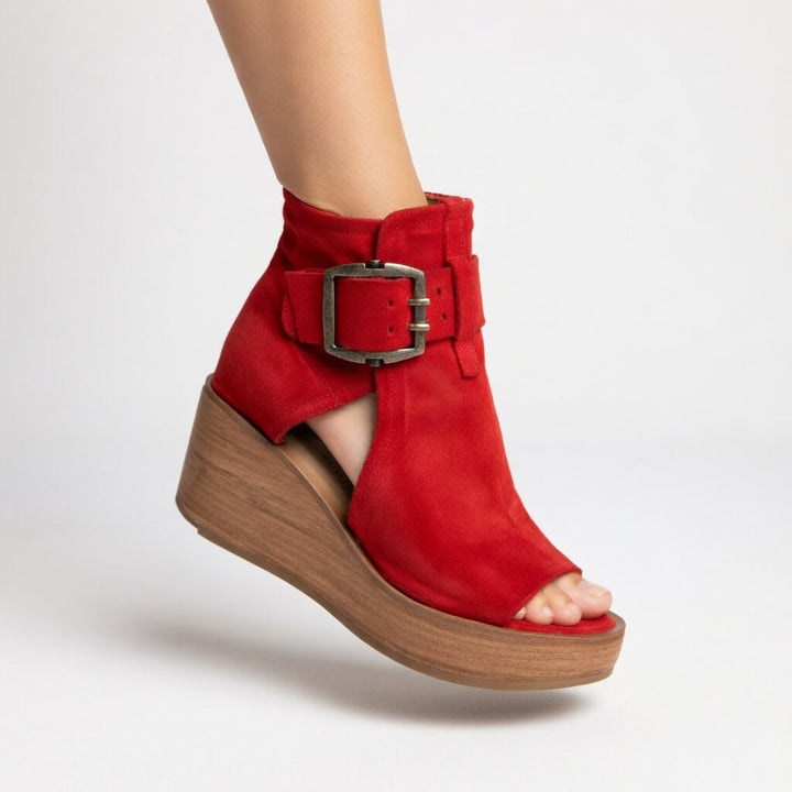 Women's stylish black open-toe wedge ankle boots. Comfortable, versatile fashion footwear for all-day wear.