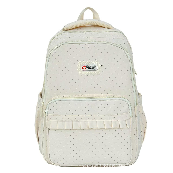 Women's stylish black polka dot ruffled backpack, perfect for school or casual use.