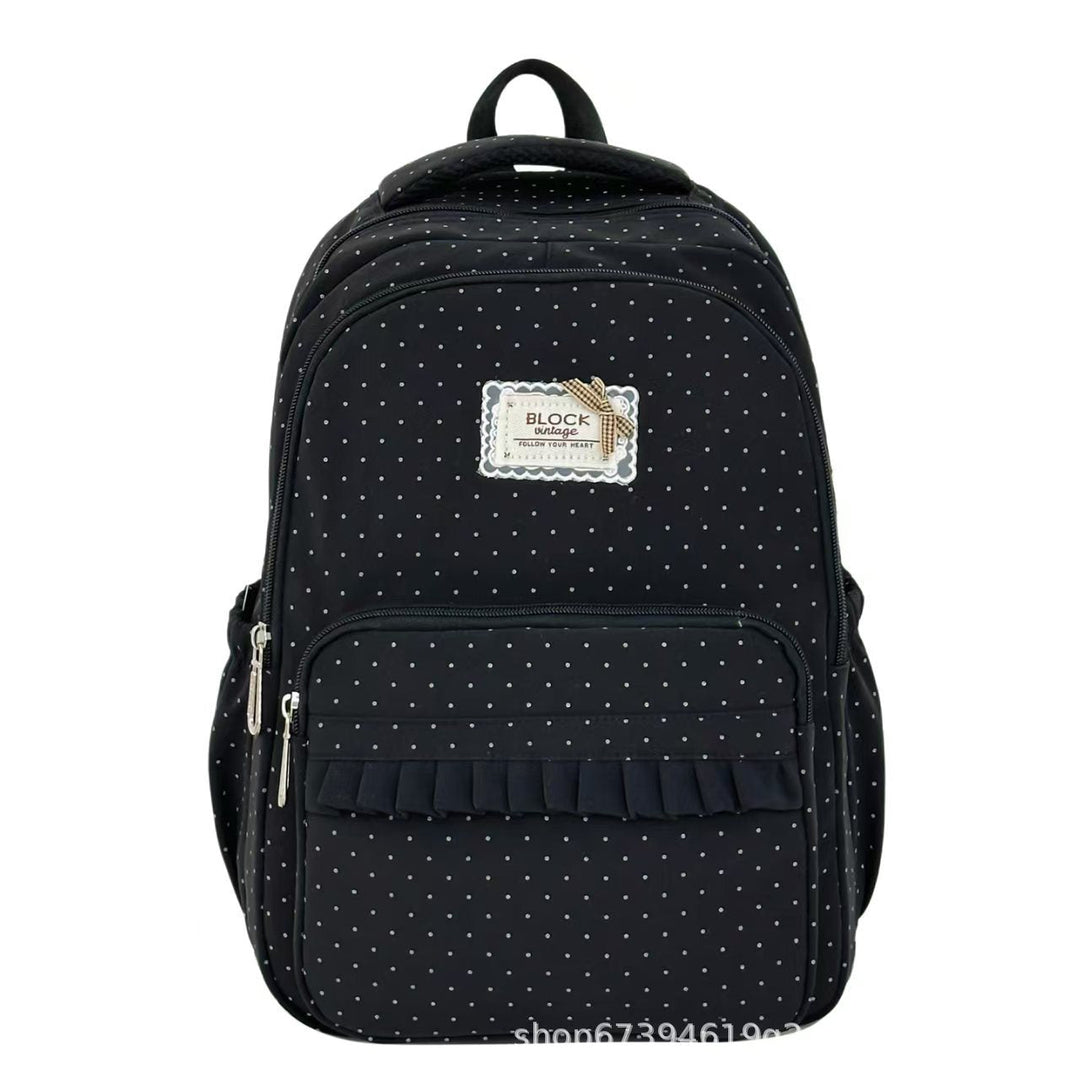 Adorable women's ruffled polka dot backpack, a stylish and practical choice for school and travel.