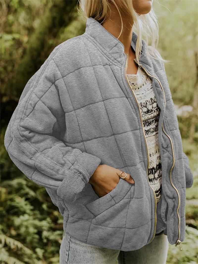 Chic women's lightweight quilted jacket with a full zipper, ideal as a versatile spring or fall outer layer.