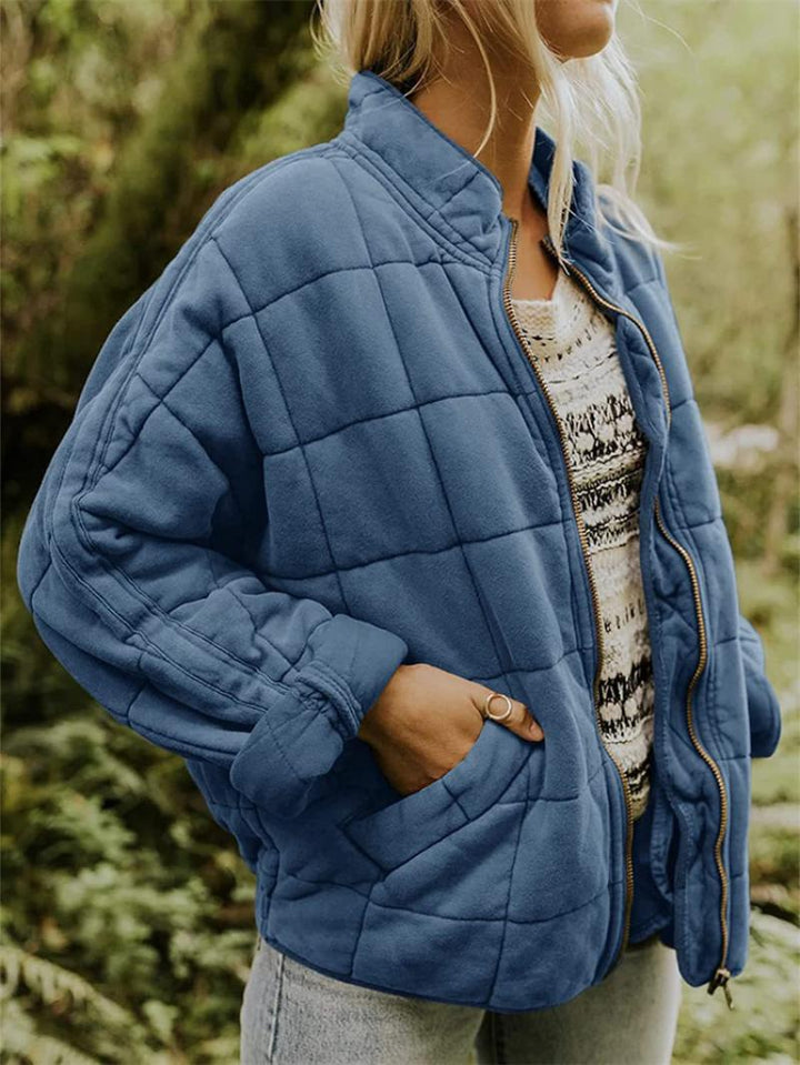 Elegant women's quilted zipper jacket, a comfortable and stylish outer layer for casual or everyday wear.