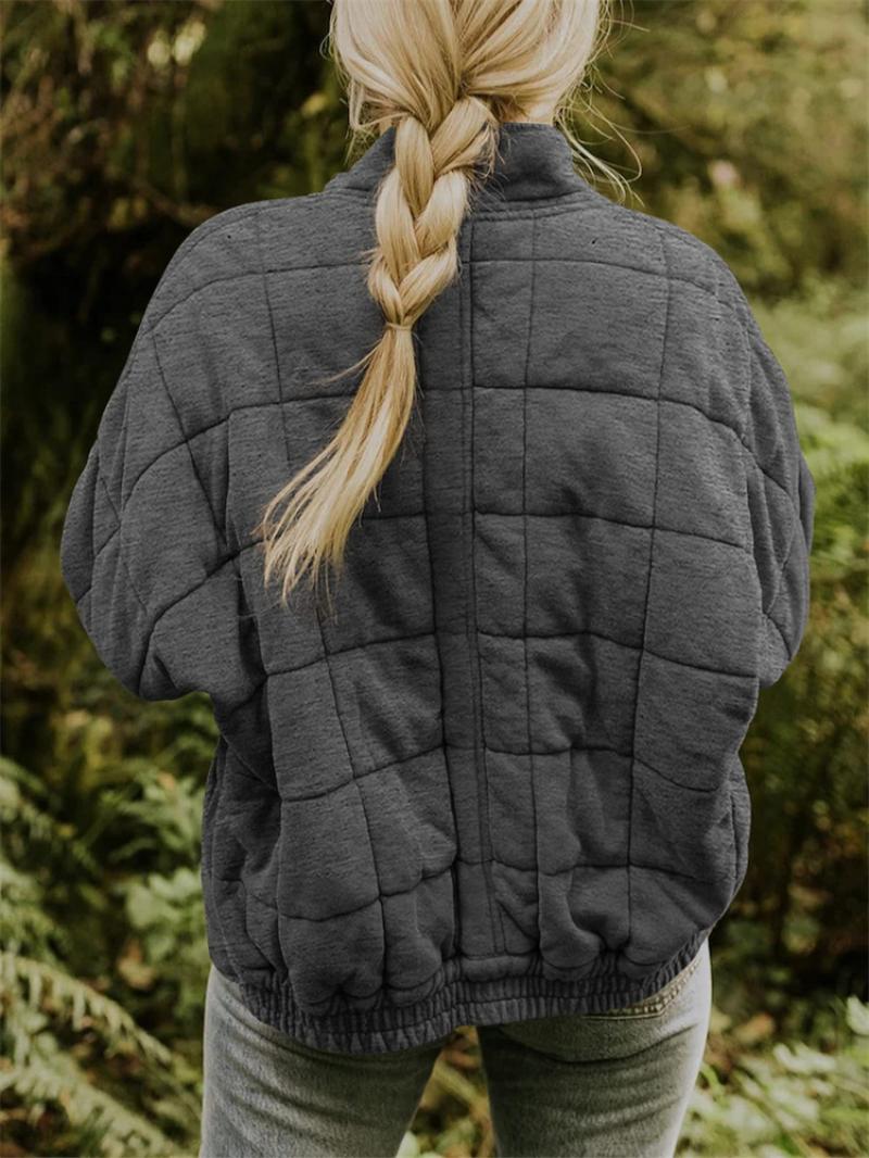 Women's chic quilted jacket with a sleek zipper design, an essential piece for fall and spring fashion.