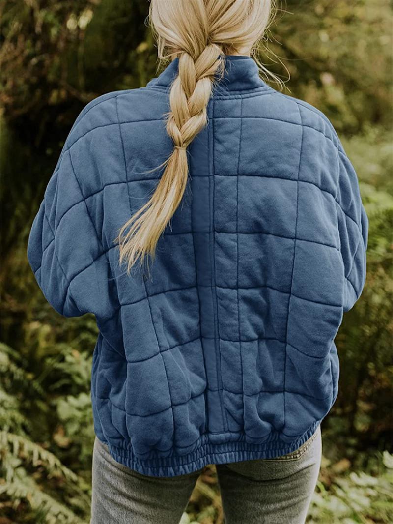 Stylish women's quilted jacket, a perfect outer layer with zipper for a casual, comfortable fall or spring outfit.