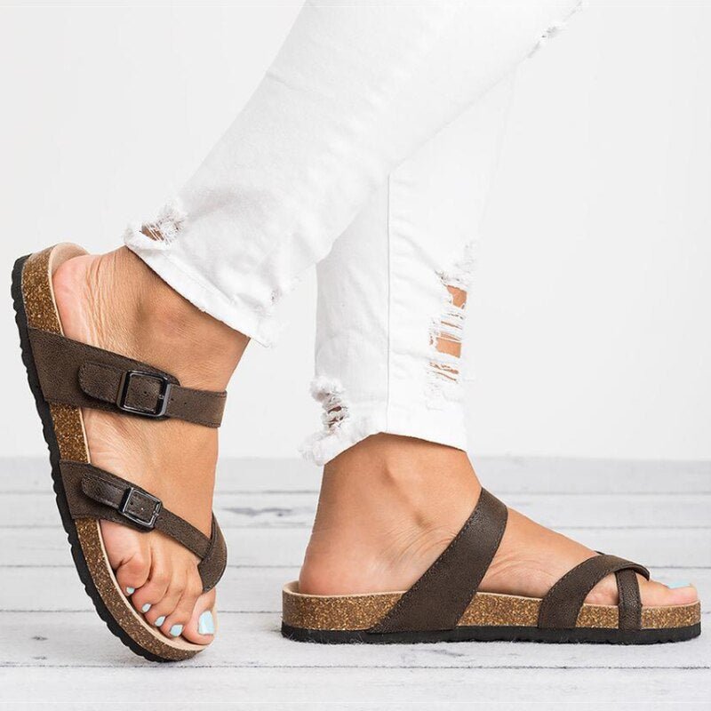Supportive women's cork toe-post flat sandals, featuring stylish buckle detail for casual summer comfort.
