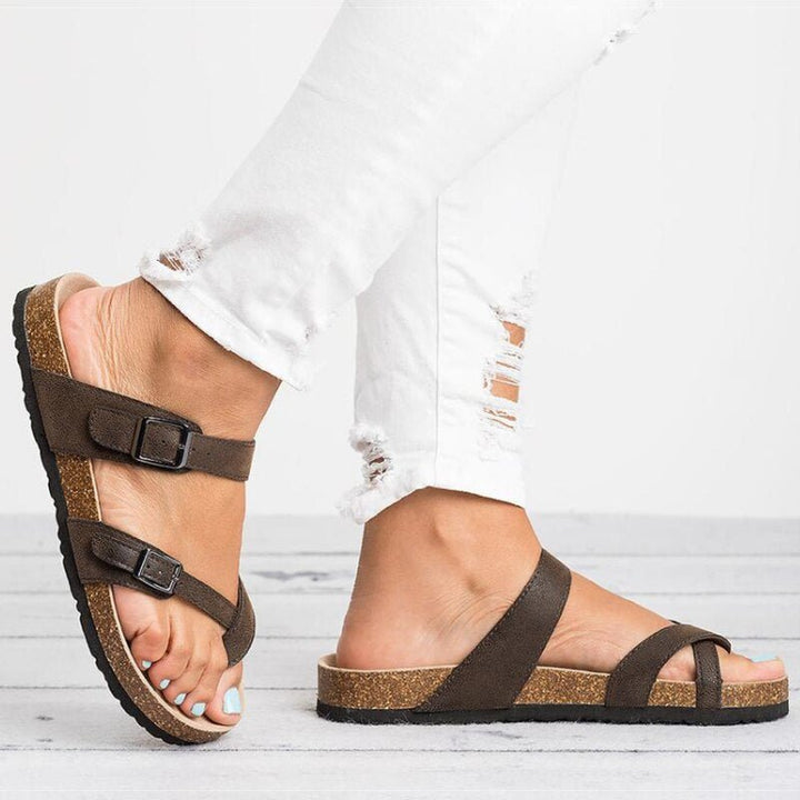 Supportive women's cork toe-post flat sandals, featuring stylish buckle detail for casual summer comfort.
