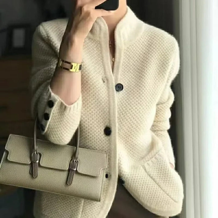 Women's stylish button-up cardigan jacket with relaxed fit & patch pockets for casual everyday wear. Modern layering piece.