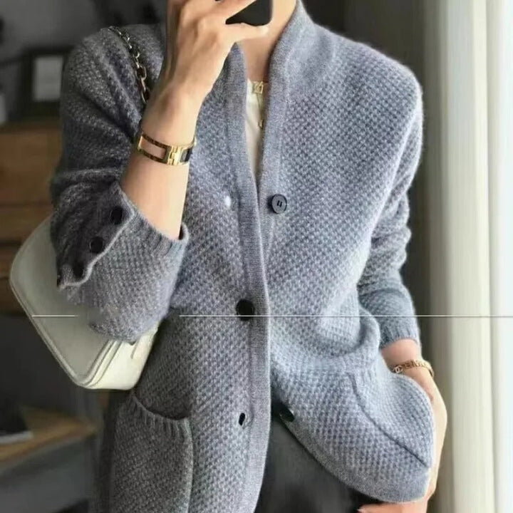 Casual chic women's button-up cardigan jacket. Comfortable relaxed fit with patch pockets, ideal for transitional everyday wear.