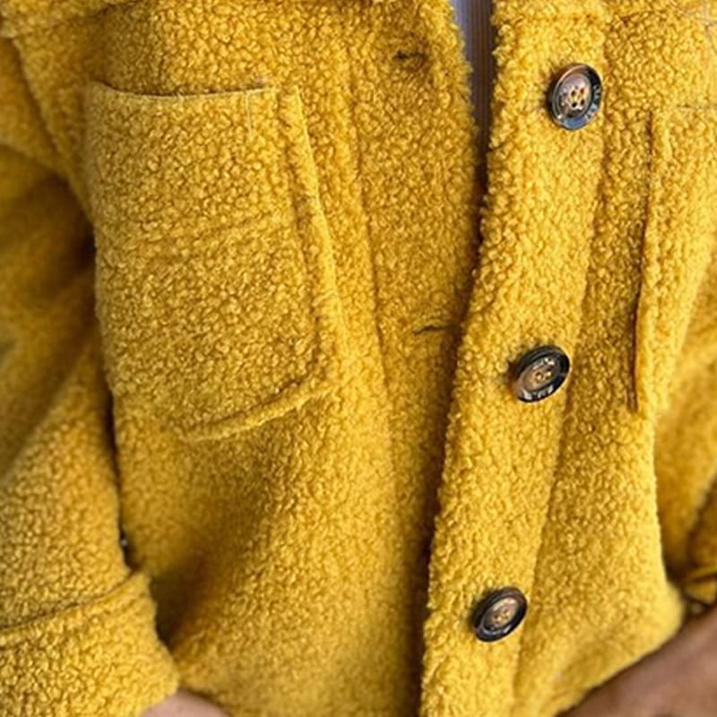 Yellow ladies' stylish jacket, a cosy and fashionable outerwear choice for comfortable everyday wear.