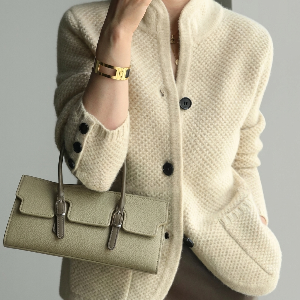 Cozy women's cable knit cardigan for layering. Stylish long-sleeve, button-front for versatile casual everyday wear.
