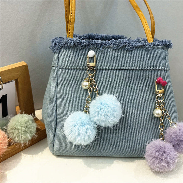 Casual women's denim handbag, a stylish tote with unique frayed edges for everyday fashion.