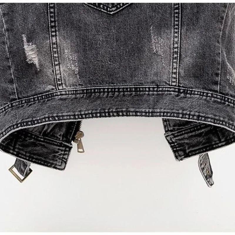 Distressed denim vest for women, a stylish sleeveless moto-inspired piece for versatile casual wear.