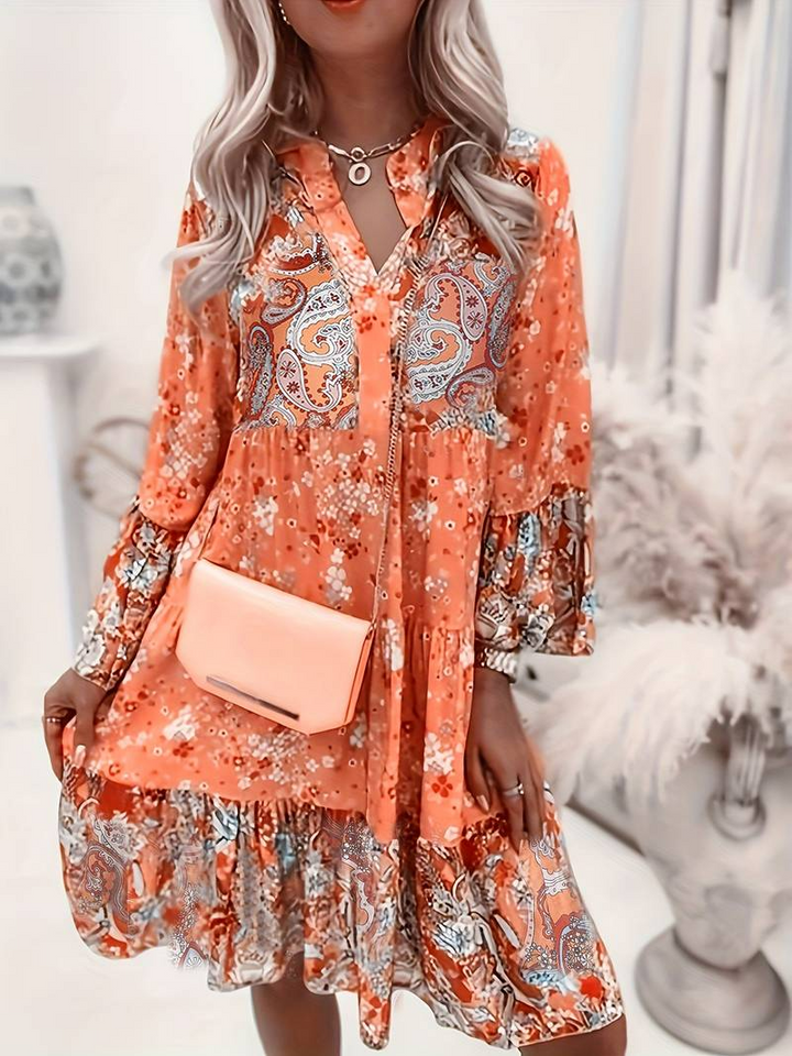Elegant women's short dress featuring a beautiful floral boho pattern, a perfect summer wardrobe essential.