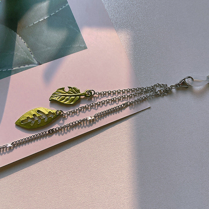 Elegant women's leaf motif glasses chain, a stylish eyewear holder & fashion accessory for daily wear.