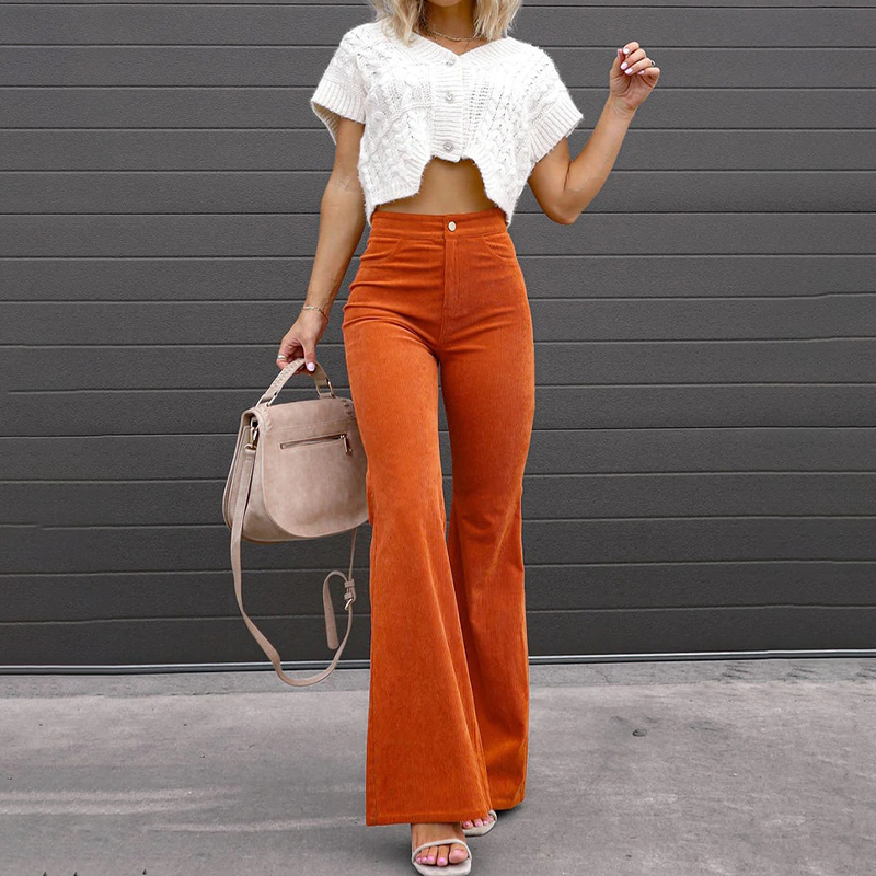 Elegant blue high-waist flared pants. Women's stylish wide-leg trousers offering comfort and a chic fashion look.