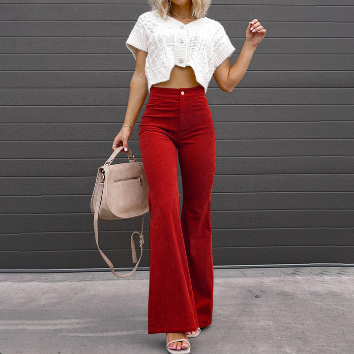 Versatile black high-waist flared pants for women. Stylish and comfortable wide-leg trousers, perfect for elegant fashion.