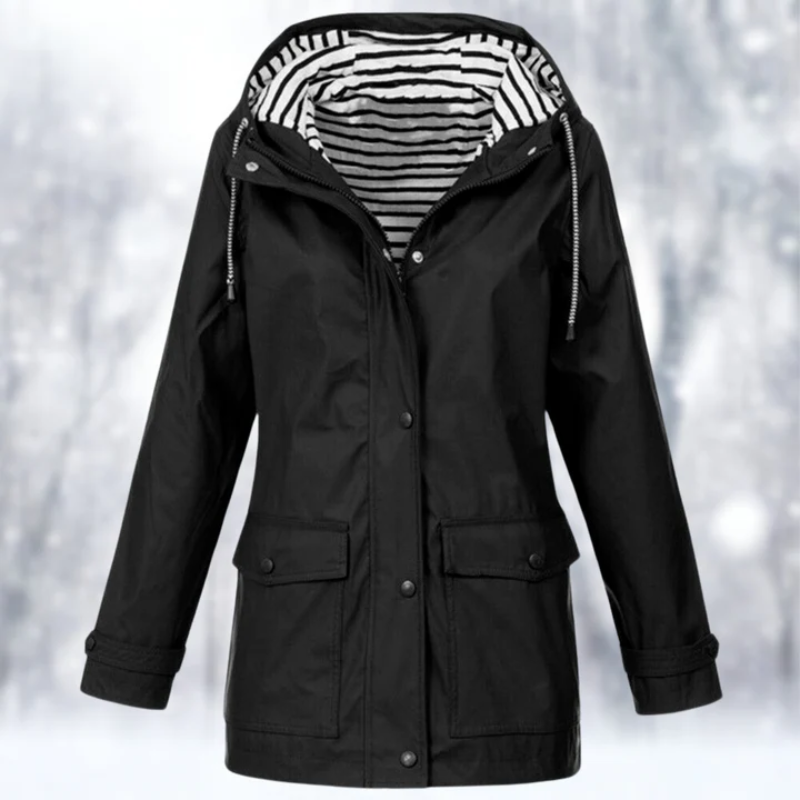 Lightweight women's waterproof raincoat with hood, ideal for travel & unpredictable spring weather.