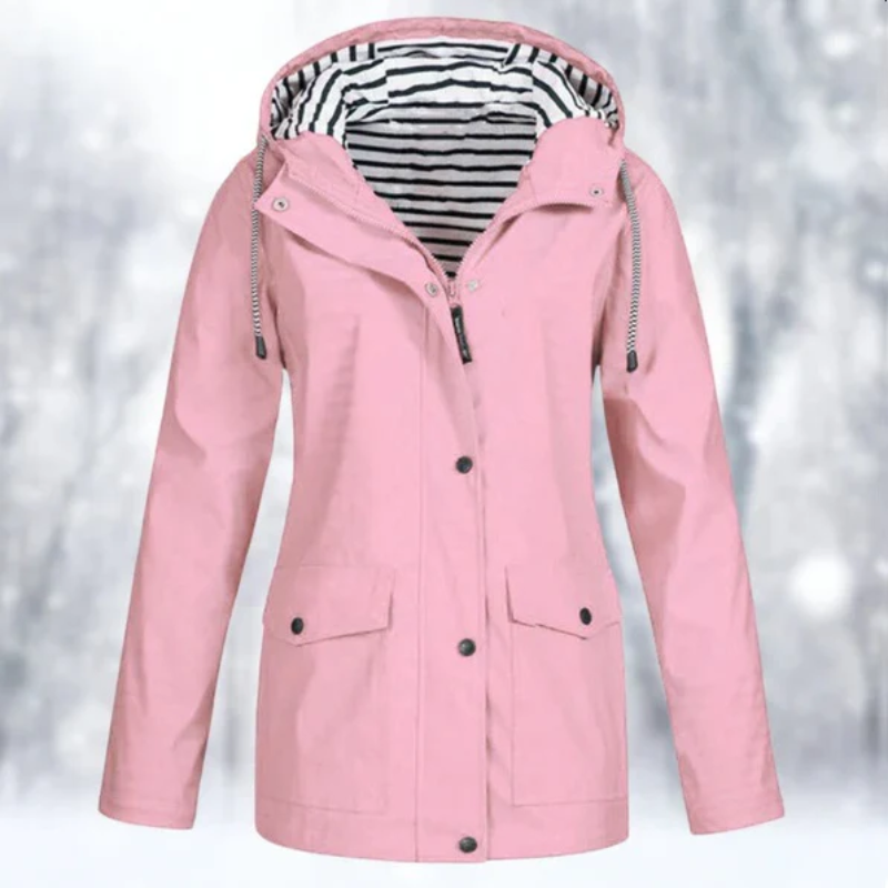 Protective women's hooded raincoat, waterproof & stylish. Essential lightweight outerwear for spring travel.