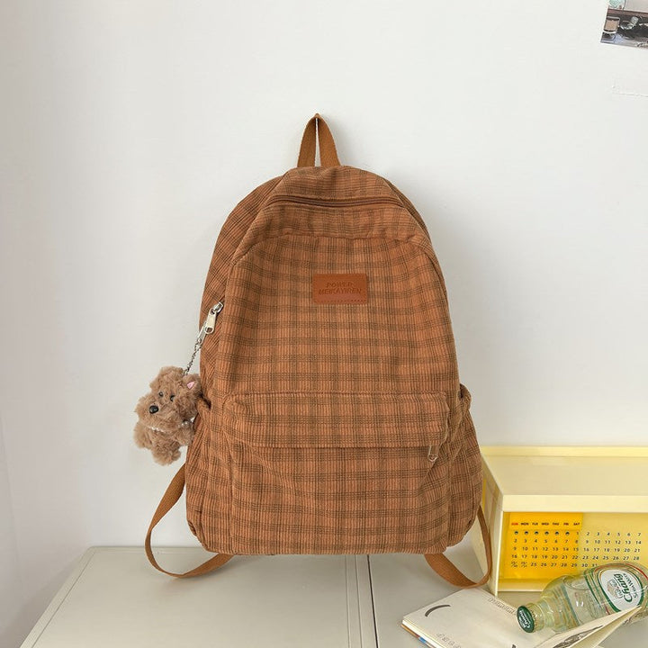 Cream & brown plaid women's backpack for students. Casual, stylish everyday carry school bag with ample space.