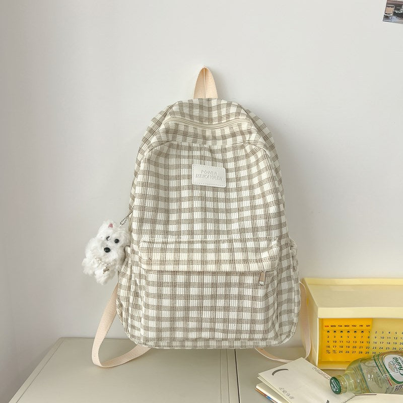 Stylish checkered school backpack for women, featuring a trendy plaid pattern in khaki tones. Ideal for students.