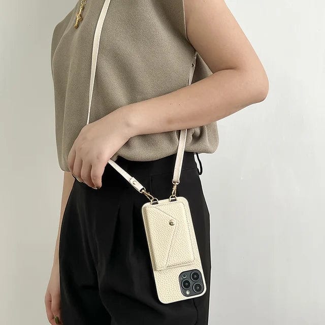 Compact leather crossbody phone case with card slots & removable key cord; ideal for stylish, hands-free wear.