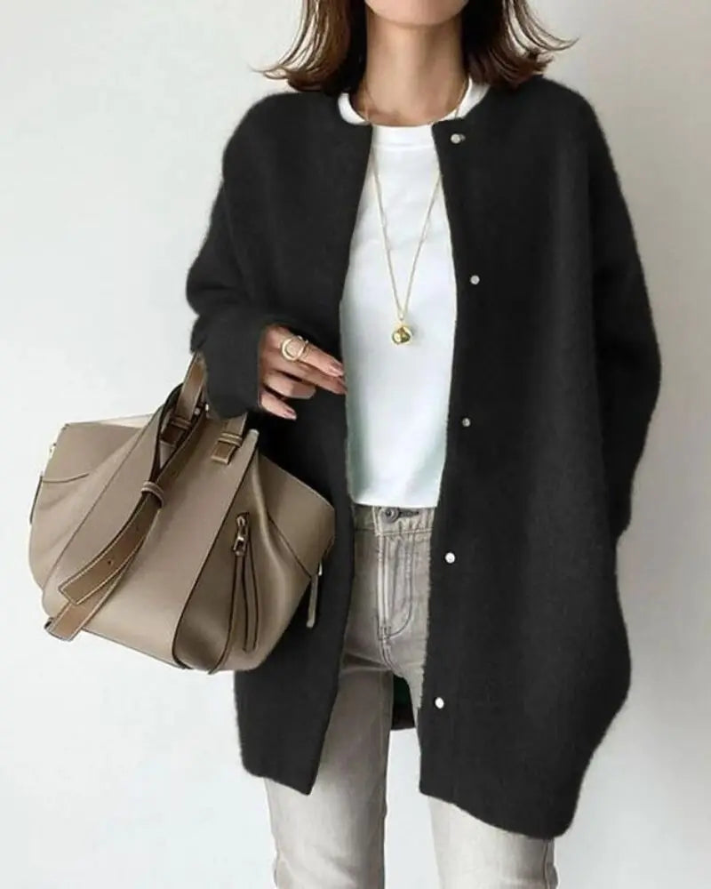 Warm women's cardigan, a stylish long sleeve lightweight sweater for comfortable everyday layering.