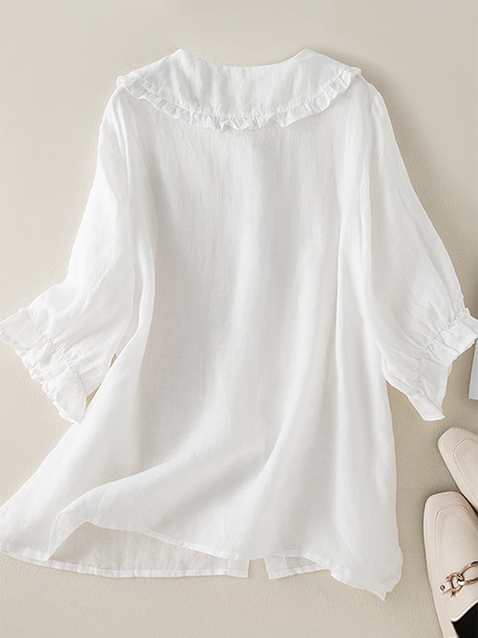 Stylish women's loose fit shirt with elegant ruffled neck. Versatile blouse for a chic, casual look.