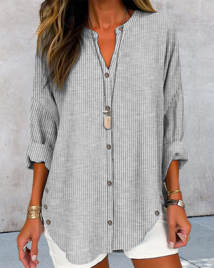 Stylish women's fashion blouse, loose fit long sleeve V-neck with button detail, perfect for versatile wear.