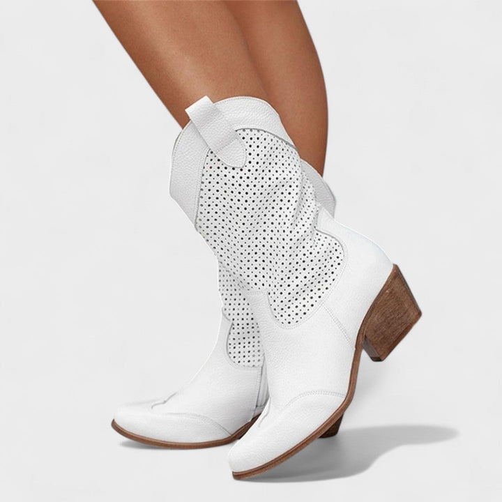 Women's fashionable perforated mid-calf boots with a sleek rounded toe and stable block heel.