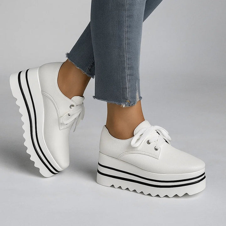 Close-up of women's stylish orthopedic sneakers, showcasing quality material & comfortable design for ladies footwear.