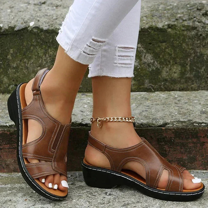 Women's stylish orthopedic wedge sandals with arch support, comfortable open-toe design & secure ankle strap.