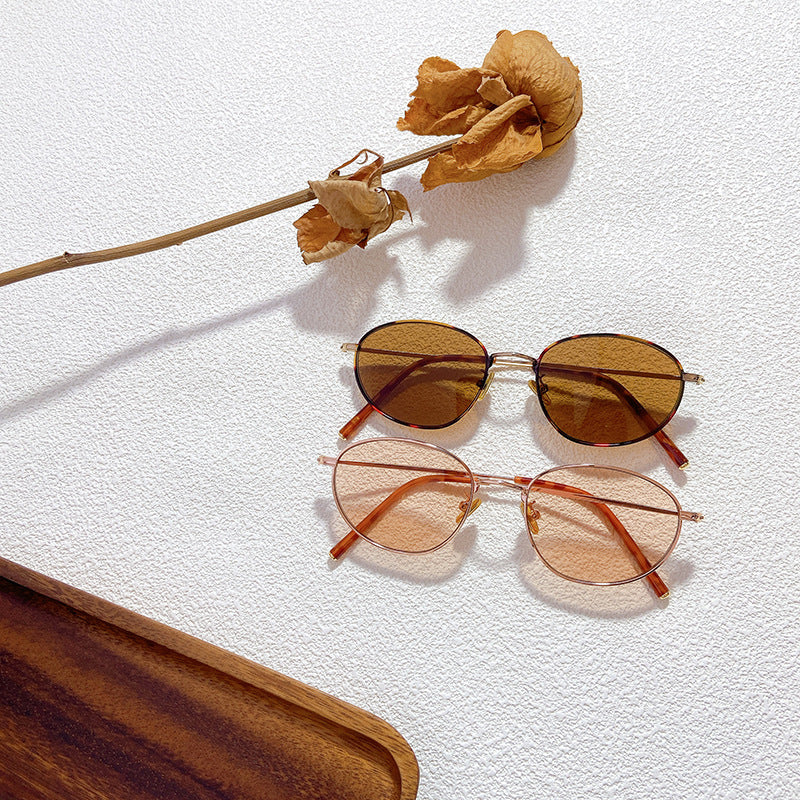 Women's stylish oval glasses with elegant frames, offering UV protection. Perfect fashion eyewear for daily wear.