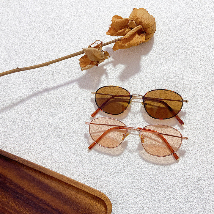 Women's stylish oval glasses with elegant frames, offering UV protection. Perfect fashion eyewear for daily wear.